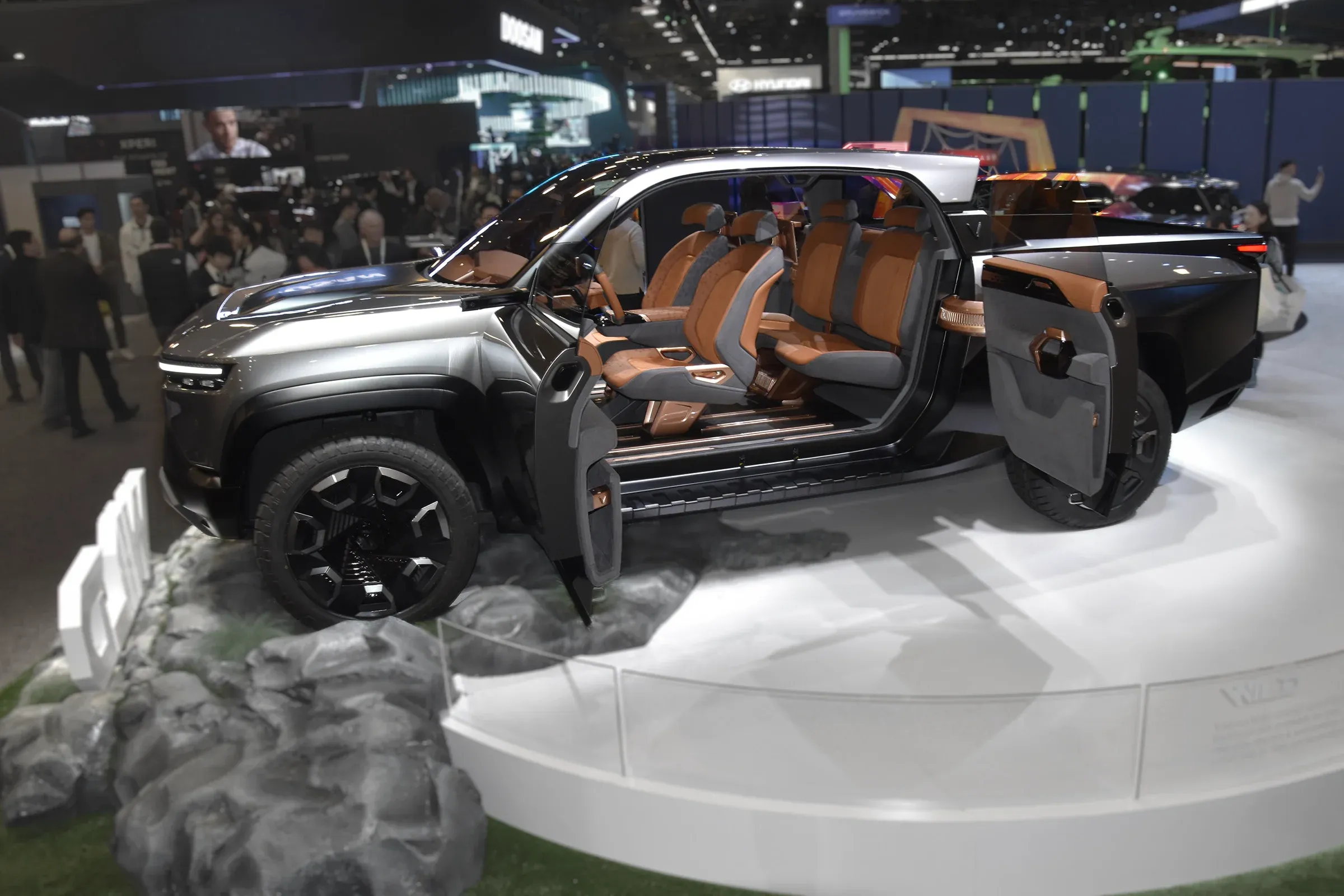 Actual vinfast truck at CES Design Expo, seen from the side with the doors open