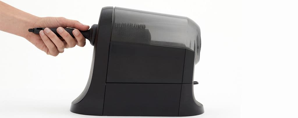 Comfortel hairbrush cleaner in use