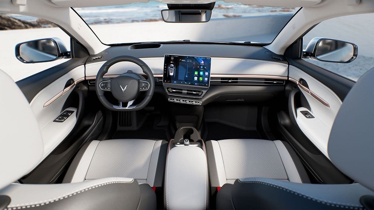 Interior of a vehicle, stately white panels and modern curves.