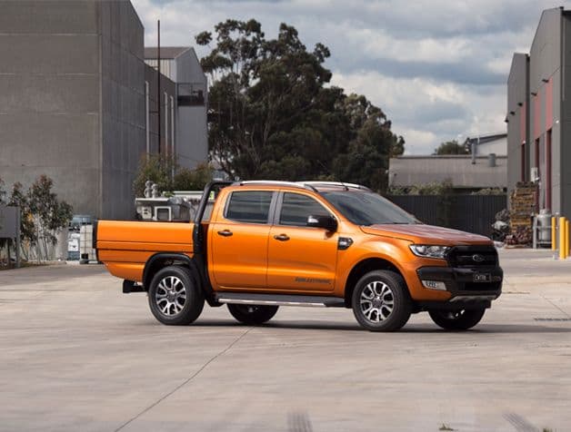 Actual implementation of the tray, on a work vehicle in quality orange