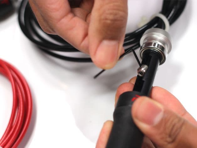 Allen key being used to adjust bolt