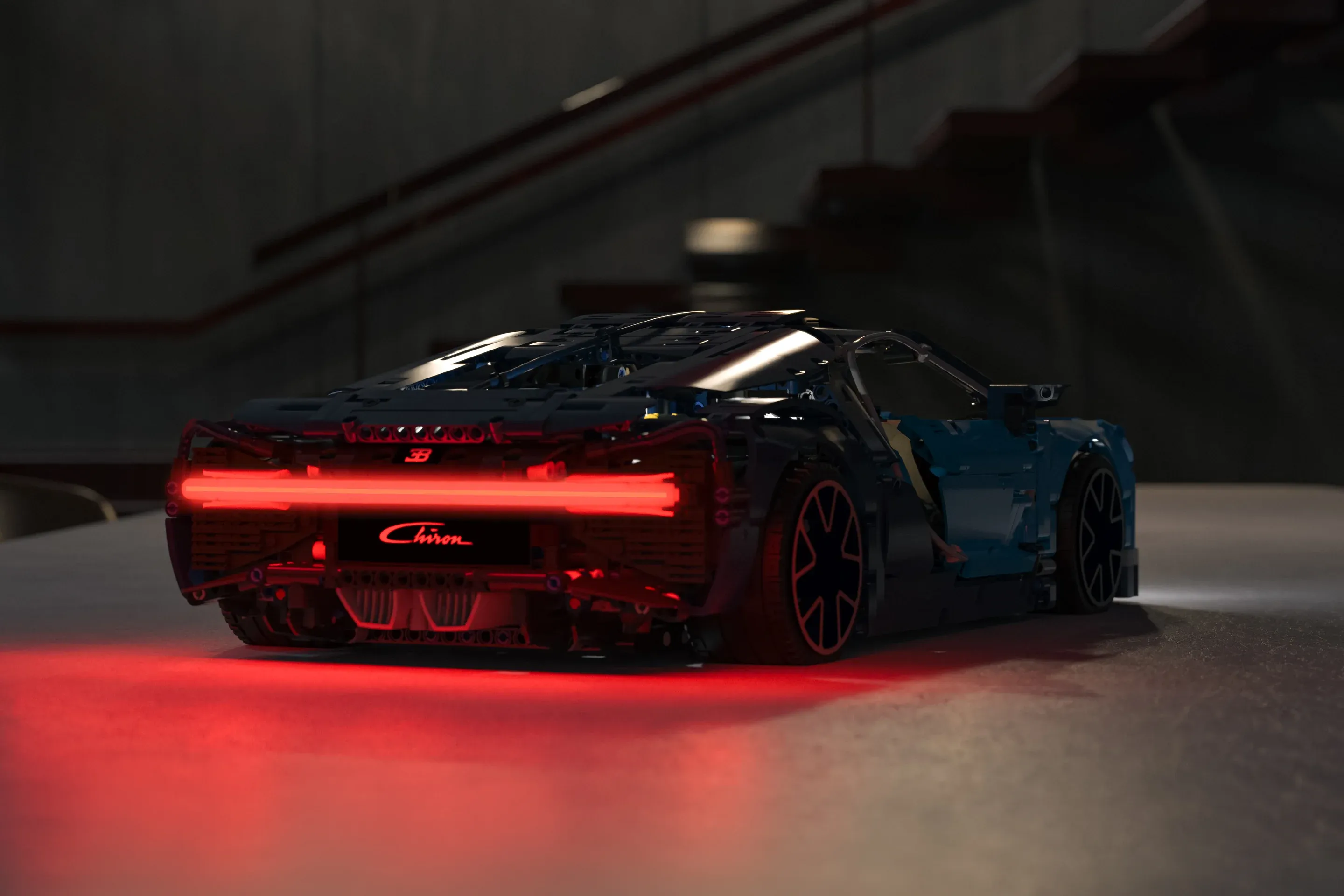 Read of a LEGO car, with red lighting kit installed as a dramatic rear light