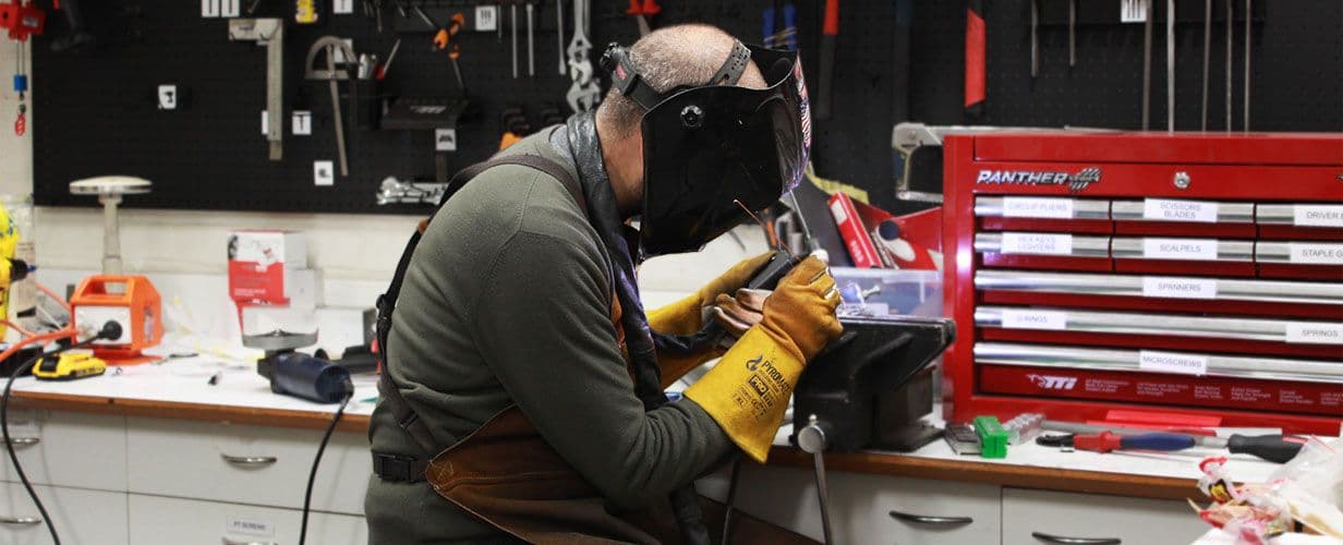 Industrial designer working on prototype in workshop