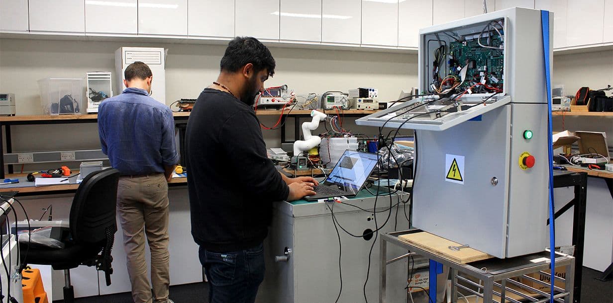 our electronic engineers working in the lab on multiple projects