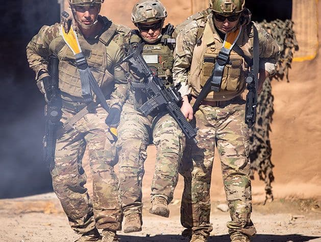 Fleetseat in use, helping carry a wounded soldier quickly across terrain