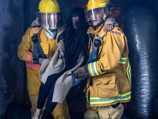 Fleetseat in use, helping carry a wounded person by search-and-rescue firefighters