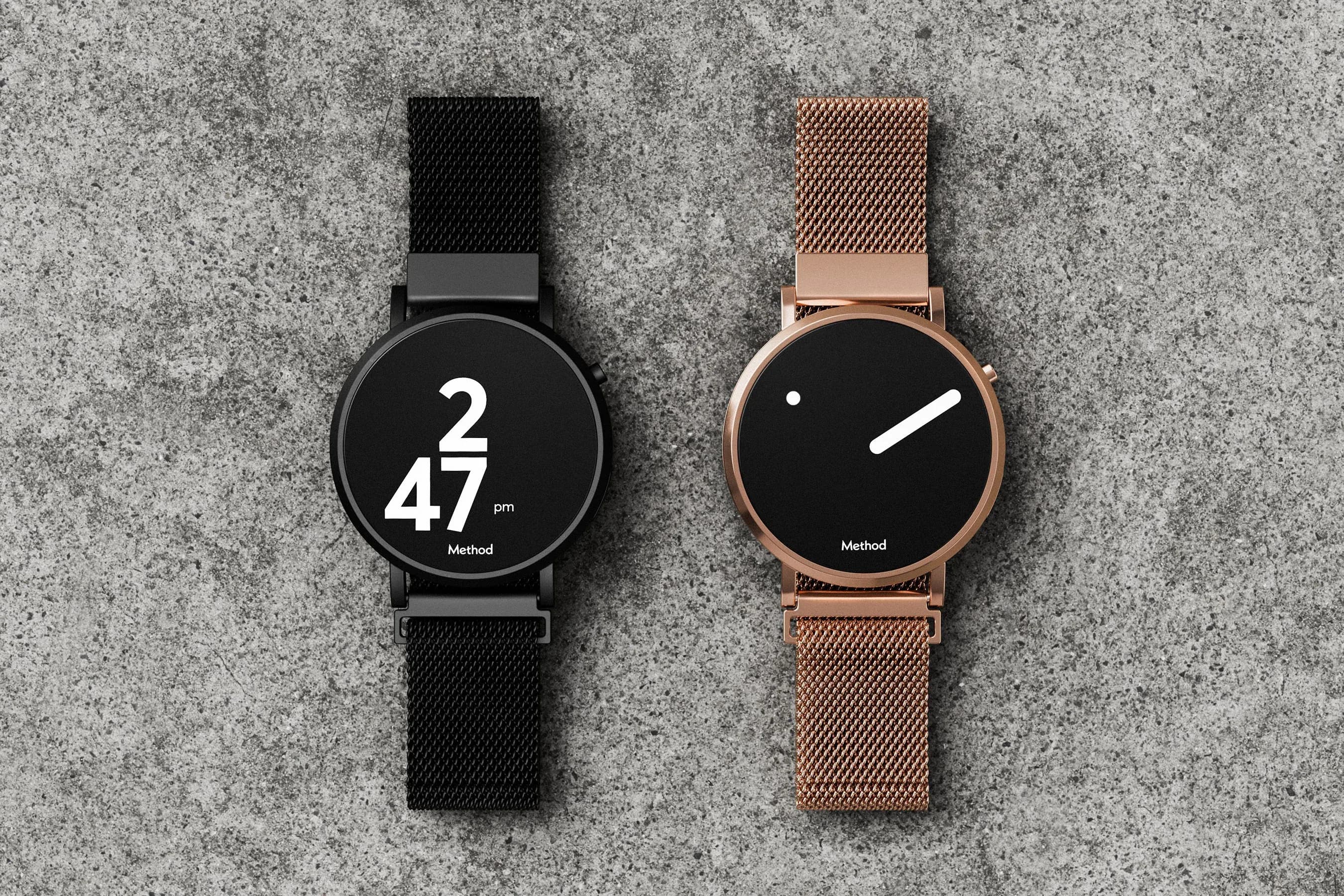 Two watch displayed on a granite stone