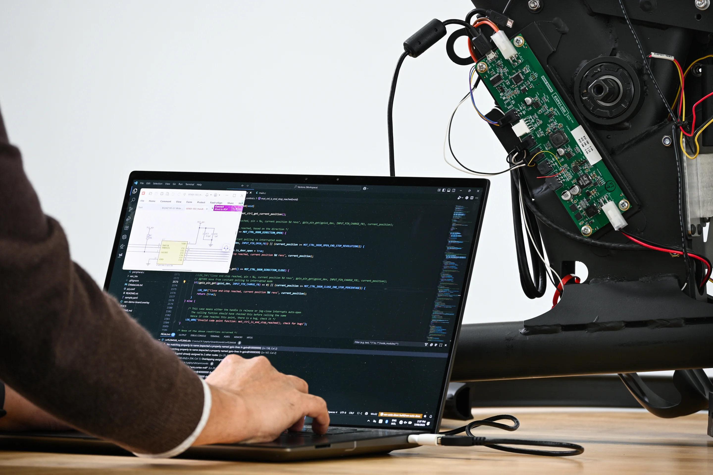 Firmware Design for the Outerspace designed Exercise bike. Designed to have a unique clutch and gamify exercise. This image shows the firmware engineer testing a prototype
