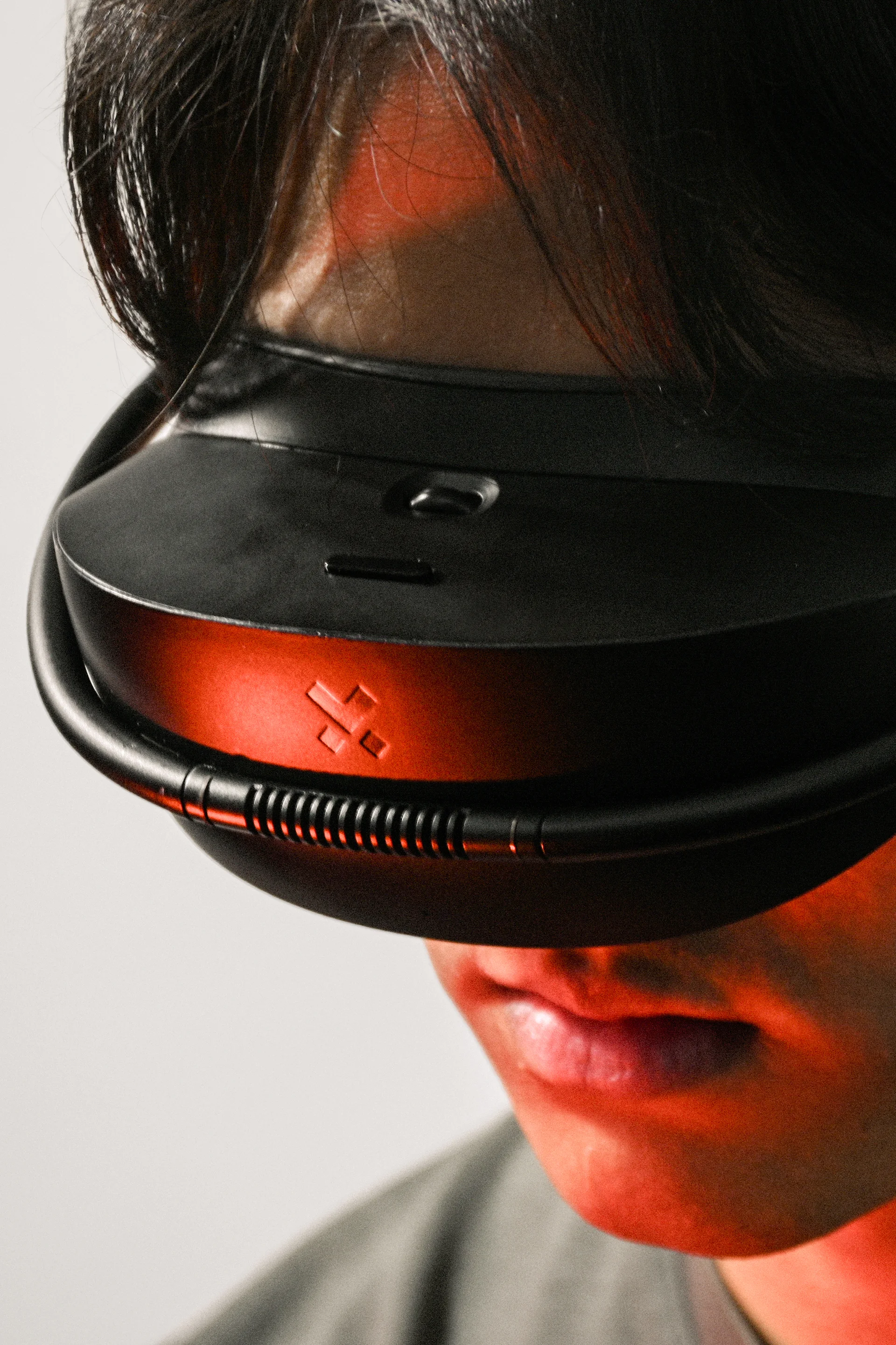 Product photography of the Outerspace designed VR headset being worn by a user. Ergonomic design and clean aesthetic