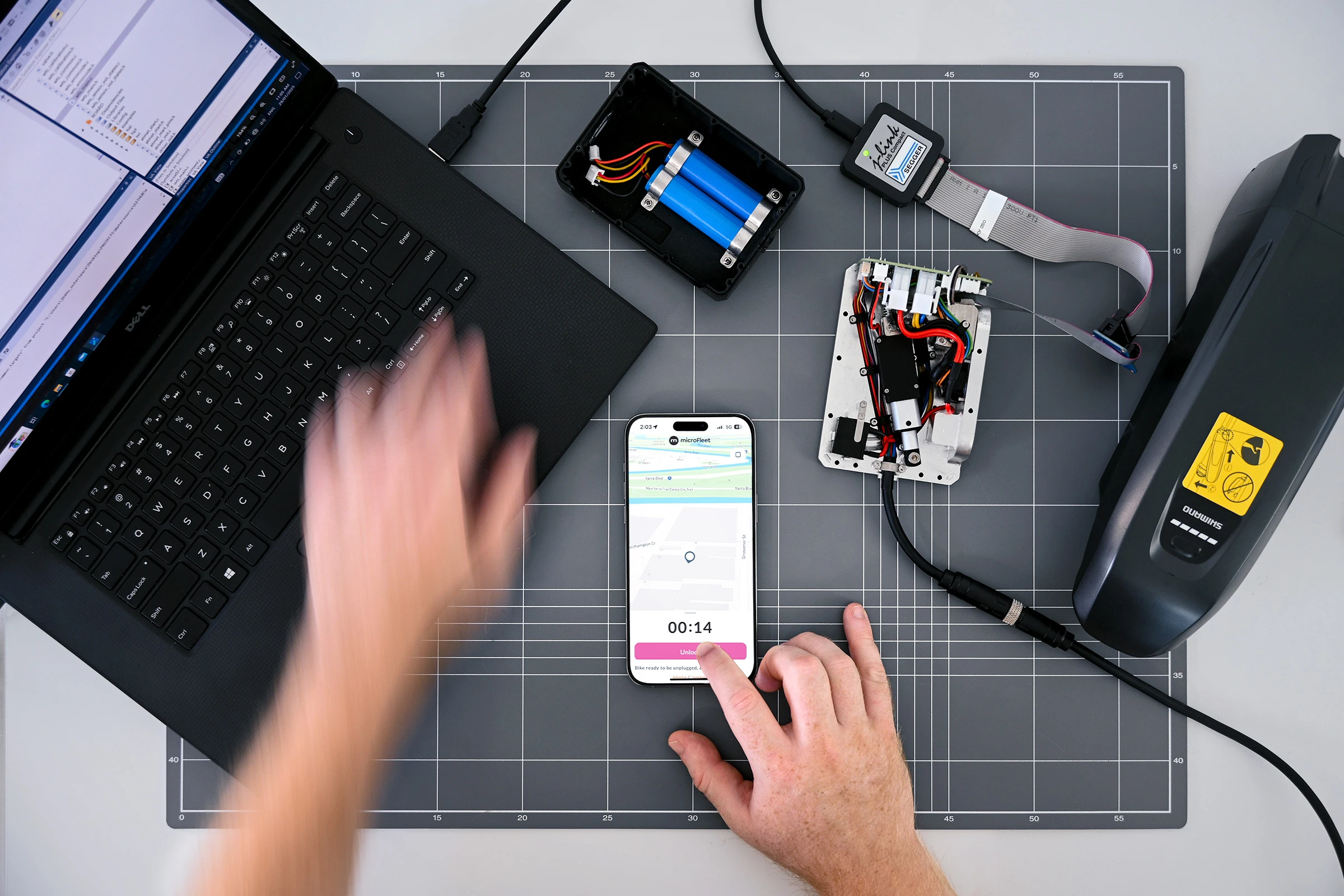 A product photo of the firmware for the OneDock microFleet charging system. Designed and Engineered by Outerspace to securely lock and charge micro-mobility electric vehicles
